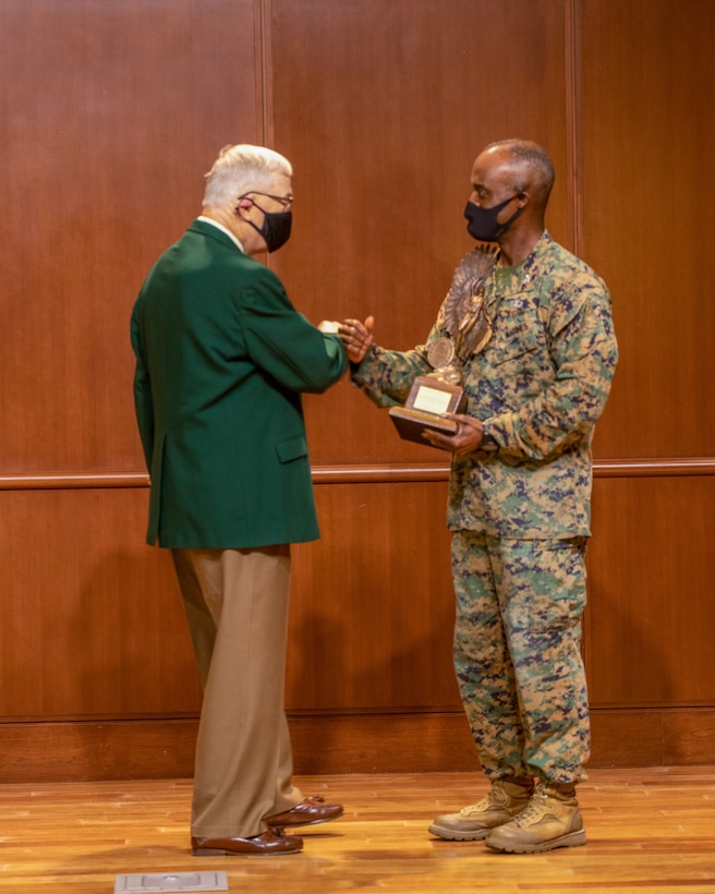 Col. Gerald Graham, the 4th Marine Aircraft Wing chief of staff, accepts the Admiral James S. Russell Naval Aviation Flight Safety Award from Lt. Gen. Nicholas Kehoe, USAF (ret.), the national commander of the Order of the Daedalians, during an award ceremony on Nov. 13, 2020 at Marine Corps Support Facility New Orleans. Pilots with 4th MAW flew more than 20,000 hours with no Class A flight-related or aviation-ground mishaps, which placed it at the top of other competitive commands. (U.S. Marine Corps photo by Lance Cpl. Mitchell Collyer)