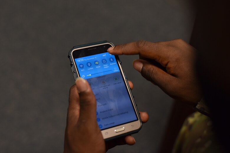 A military member adjusts their settings to receive emergency alerts through their phone Nov. 19, 2020, on Goodfellow Air Force Base, Texas. Adjusting notifications will ensure all notifications are received by the phone user. (U.S. Air Force photo by Staff Sgt. Seraiah Wolf)