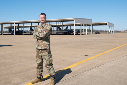 Capt. Andrew Gibler poses for a photo on the flightline on March 8, 2020, at Joint Base Langley-Eustis, Virginia. He has applied his experience and passion for mechanics to his job as a maintenance officer in the 192nd Aircraft Maintenance Squadron.