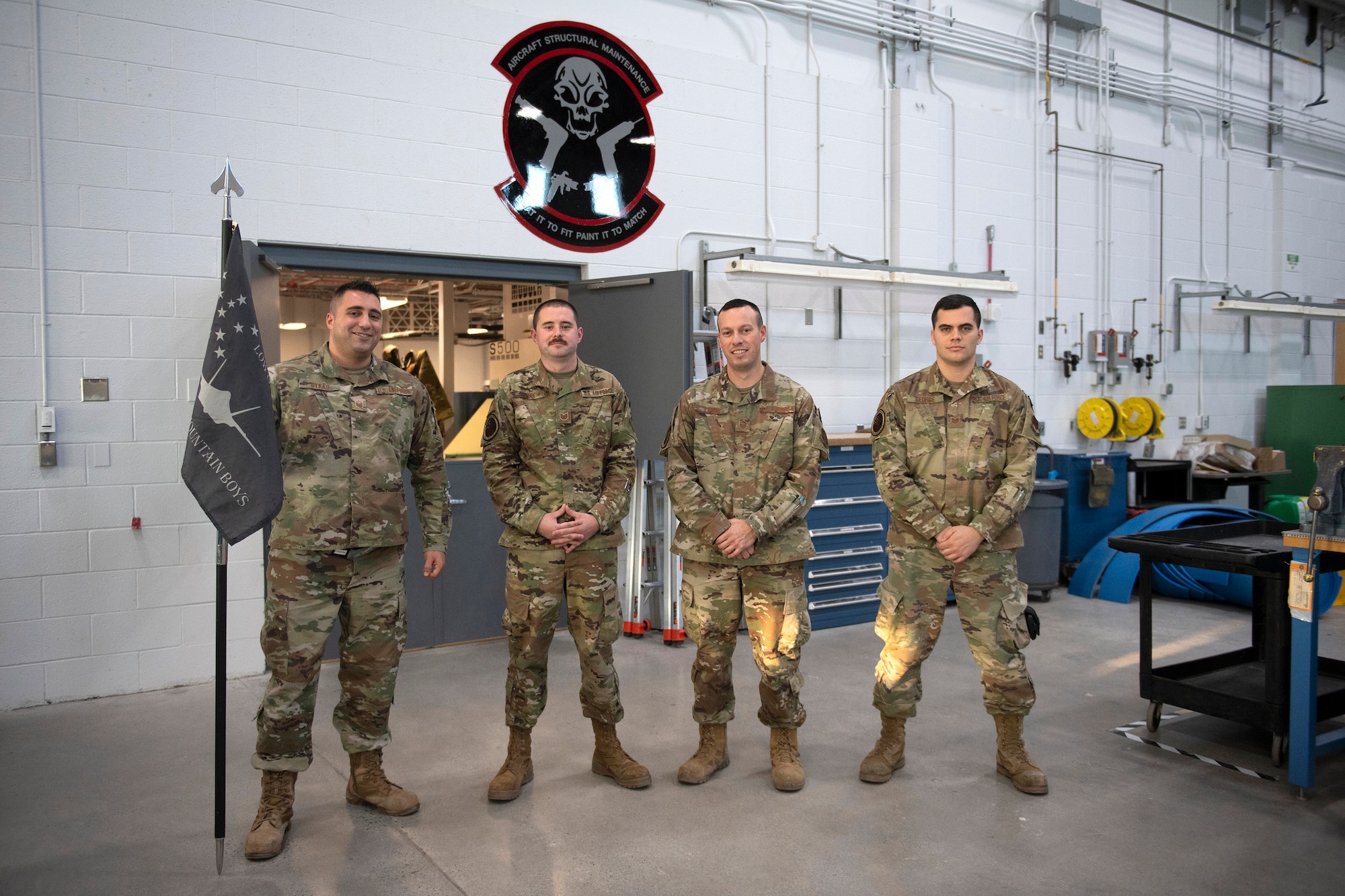 Master Sgt. Dykas, Tech. Sgt. Bohan, Master Sgt. Lamay and Tech Sgt. George, members assigned to the 158th Maintenance Group low observable shop, stand for a group portrait in their new building at the Vermont Air National Guard base.