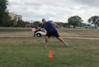 Petty Officer 1st Class Steve Comacho, Navy Talent Acquisition Group San Antonio leading petty officer and accessor, winds up as he gets ready to throw a disc during a disc golf tournament at the Joint Base San Antonio-Fort Sam Houston Golf Course Oct. 23.