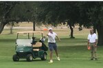 Kenneth Boyce, (left), Joint Base San Antonio's Randolph Oaks Golf Course manager, throws a disc during a disc golf tournament held at the JBSA-Fort Sam Houston Golf Course Oct. 23. Awaiting his turn is Fernando Brown, (right), 502nd Force Support Squadron assistant flight chief, community services.