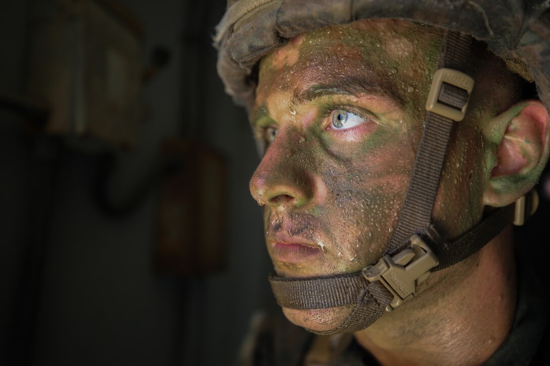 A U.S. Marine with 1st Battalion, 1st Marine Regiment, 1st Marine Division posts security at a window during a Kilo 2 Military Operations in urban terrain (MOUT) evaluation at Marine Corps Base Camp Pendleton, California, Oct. 18, 2020.