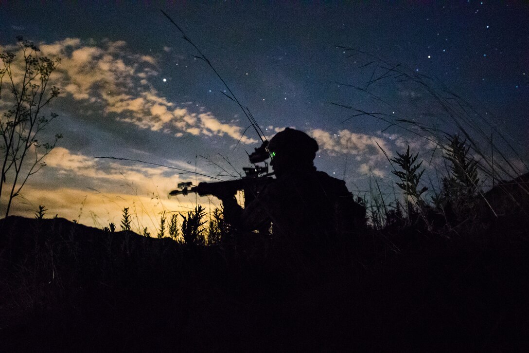 U.S. Marine Lance Cpl. James Esquibel, a rifleman with 3rd Battalion, 4th Marine Regiment, 1st Marine Division scans a road for notional enemies during a Marine Corps Combat Readiness Evaluation (MCCRE) on Marine Corps Base Camp Pendleton, Calif., Aug. 12, 2020