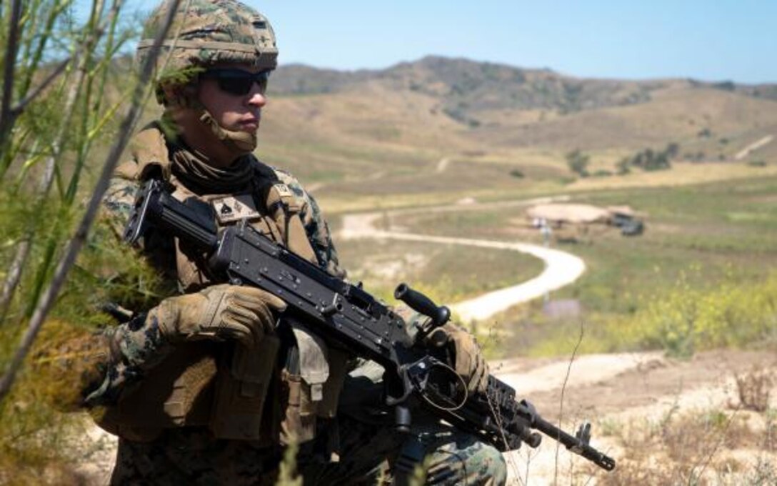 A U.S. Marine with the 1st Marine Division (1st MARDIV) Band conducts a ground patrol exercise at Marine Corps Base Camp Pendleton, California, May 27, 2020. The 1st MARDIV Band’s secondary mission is to serve as a security platoon to the Commanding General when forward deployed. (U.S. Marine Corps photo by Lance Cpl. Jacob Yost)