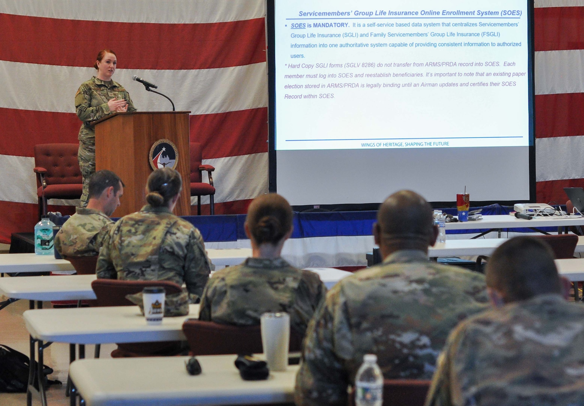 NCOIC Customer Support Staff Sgt. Amanda Rehberg, 301st Fighter Wing Force Support Squadron, presents a Servicemembers’ Group Life Insurance coverage brief to wing leadership during the Officer Leadership Summit at U.S. Naval Air Station Joint Reserve Base Fort Worth, Texas, on November 17, 2020. SGLI offers low-cost term coverage to eligible service members and the brief helps leaders ensure their Airmen understand programs benefits and how to verify coverage. (U.S. Air Force photo by Senior Airman William Downs)