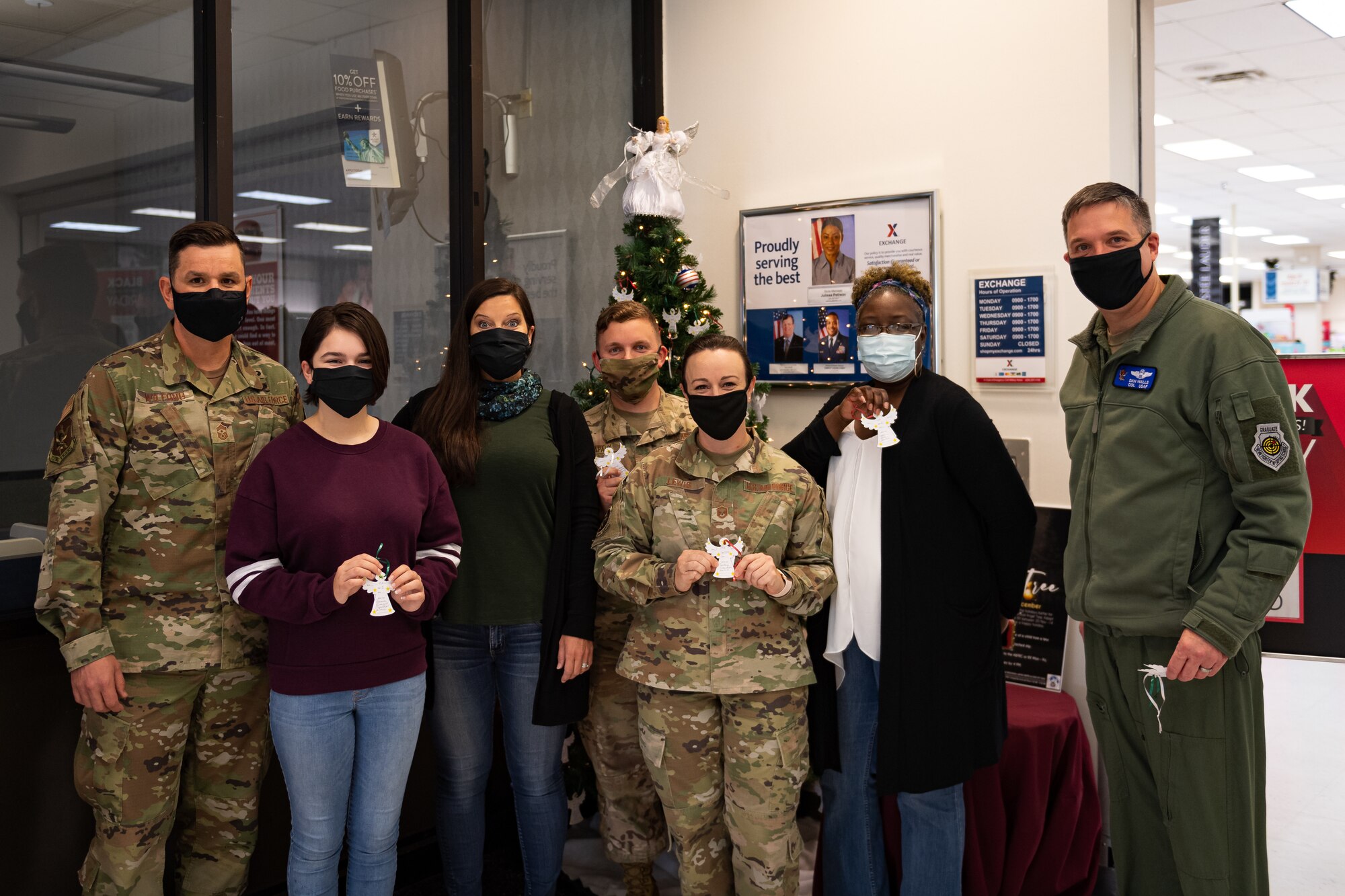 A photo of Airmen and families posing for a photo