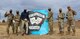 Members of the 19th Space Operations Squadron gather around the spirit rock displaying namesakes outside the fitness center to celebrate their cornhole championship Nov. 18, 2020, at Schriever Air Force Base, Colorado. The 19th SOPS won the base’s first-ever intramural cornhole tournament and beat 22nd SOPS 21-16, 21-19 in the finals. The ongoing pandemic scrapped other intramural sports and caused the 50th Force Support Squadron to create fun, alternative sports. (U.S. Space Force photo by Marcus Hill)