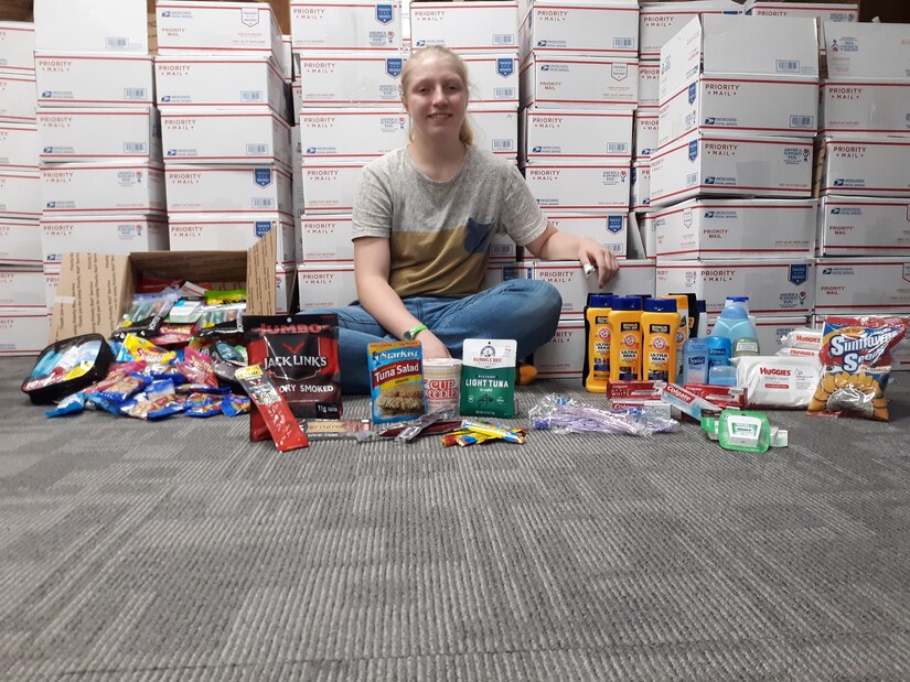 Lily Palfrey, daughter of 1st Sgt. Frank Palfrey who is the senior enlisted advisor for Headquarters and Headquarters Company, 28th Expeditionary Combat Aviation Brigade, organized 154 care packages to be sent to her father's deployed unit. (Courtesy Photo by Lily Palfrey)