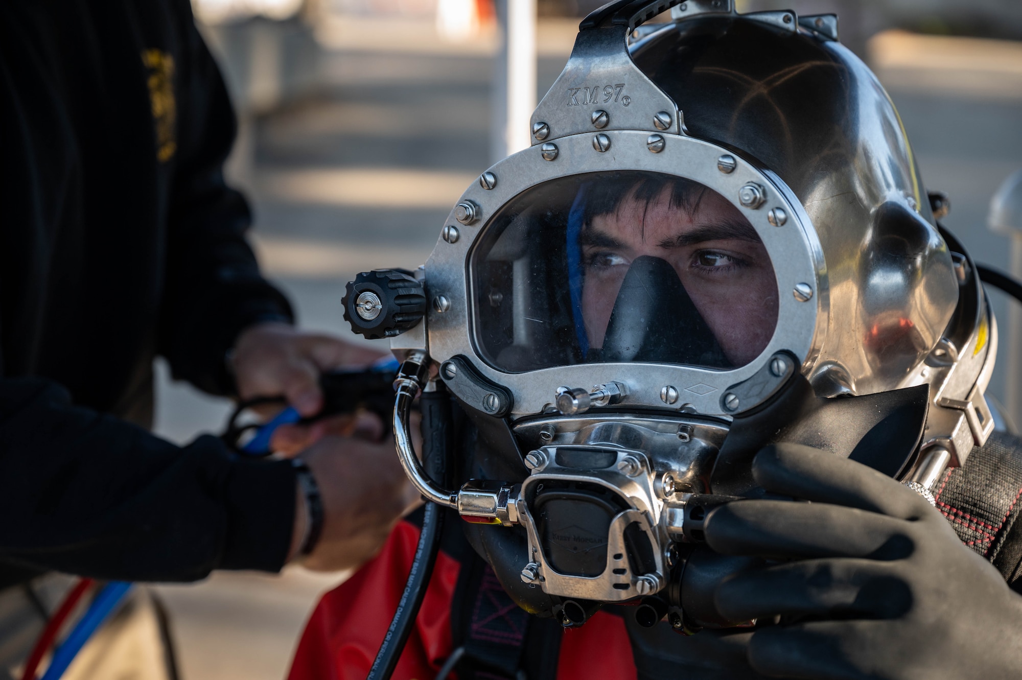 A U.S. Army Soldier prepares for a simulated contaminated water diving field training exercise.
