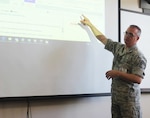 Chief Master Sgt. Shawn Peno instructing members of the New York Guard, the state's defense force, on the use of the computer communications system used by the New York National Guard during disasters, at Camp Smith Training Site on June 24, 2017.