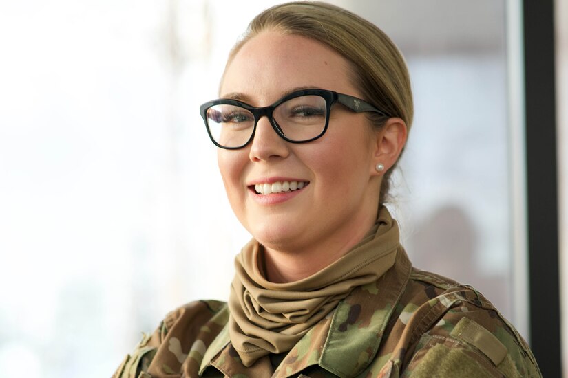 An airman poses for a photo.