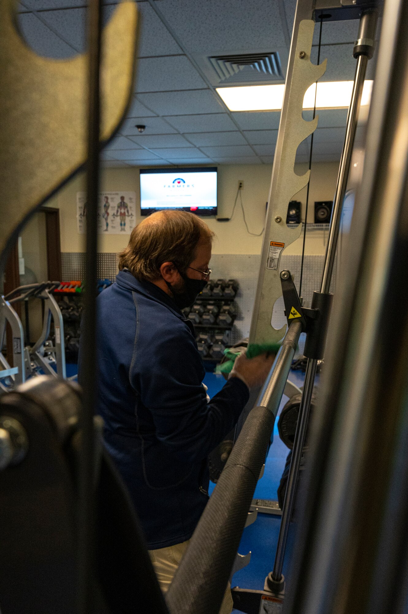 Alan Hill, 911th Force Support Squadron outdoor recreation assistant, sanitizes gym equipment at the Pittsburgh International Airport Air Reserve Station, Pennsylvania, Nov. 19, 2020.