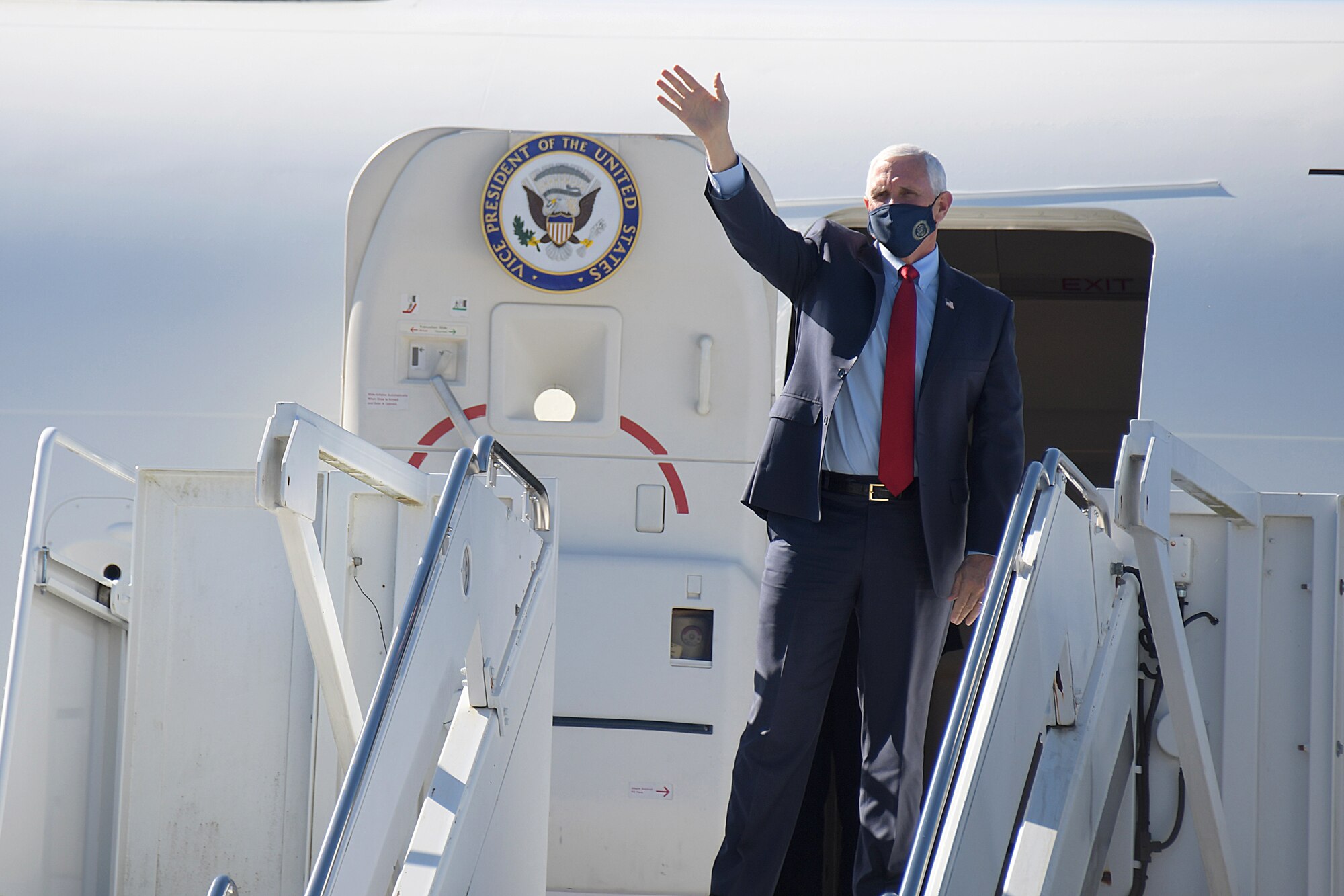 Vice President Mike Pence waves to onlookers at Dobbins Air Reserve Base, Ga. shortly after arriving on Air Force Two, Nov. 20, 2020. The vice president was greeted by Georgia Gov. Brian Kemp and U.S. Sens. David Perdue and Kelly Loeffler.  (U.S. Air Force photo/Andrew Park)