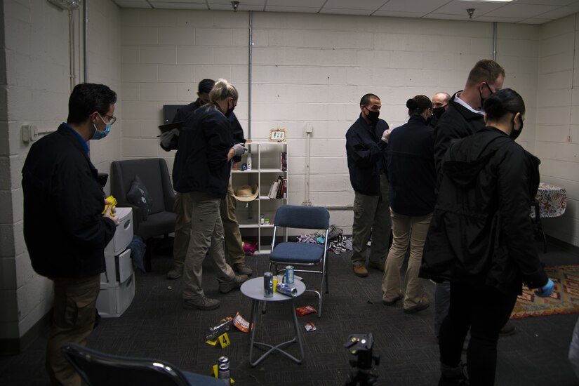 U.S. Air Force Office of Special Investigations agents and Security Forces Office of Investigations agents process the mock crime scene during training at Joint Base Andrews, Md., Oct. 30, 2020. Evidence is a key component of building a case.