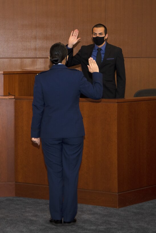 U.S. Air Force Special Agent Eduardo Perez-Cabon, Detachment 331 Office of Special Investigations, takes an oath before testifying on the stand at Joint Base Andrews, Md., Nov. 6, 2020. Agents testified in a mock court martial before an open panel about their handling of evidence and the scope of the criminal investigation.