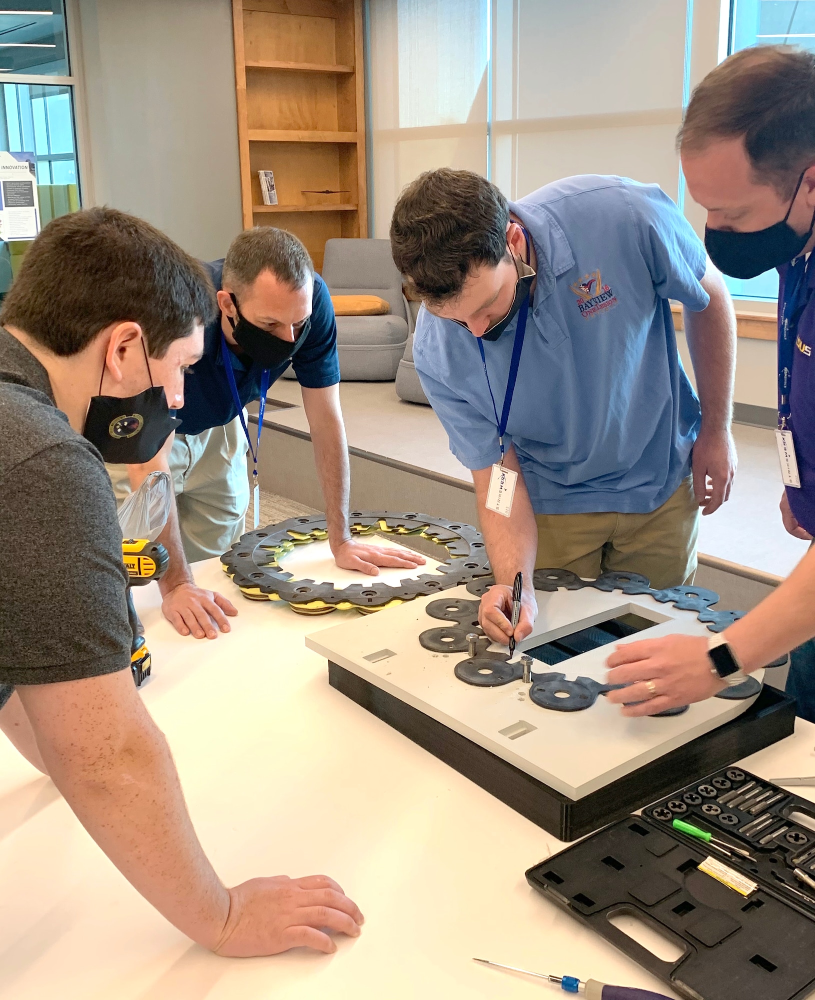 Airmen and academia partners from Louisiana Tech University and LSU Shreveport work on refining the prototype design to solve drilling of B-52 brakes during a Design Sprint held at STRIKEWERX in Bossier City, La., Nov. 16-19, 2020.