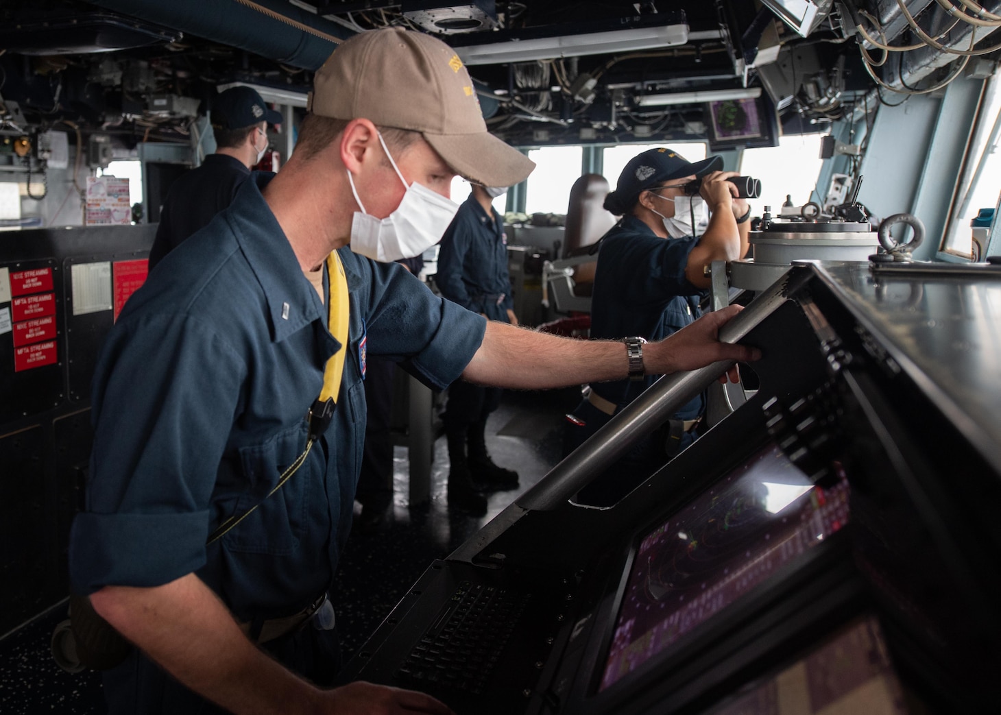 TAIWAN STRAIT (Nov. 20, 2020) – Lt. j. g. Benjamin Pershall, from Annapolis, Md., uses the Automated Radar Plotting Aid (ARPA) on the bridge of the guided-missile destroyer USS Barry (DDG 62) as the ship conducts routine underway operations in the Taiwan Strait. Barry is assigned to Destroyer Squadron (DESRON) 15, the Navy’s largest forward-deployed DESRON and the U.S. 7th Fleet's principal surface force, forward-deployed to the U.S. 7th Fleet area of operations in support of a free and open Indo-Pacific. (U.S. Navy photo by Mass Communication Specialist Seaman Molly Crawford)