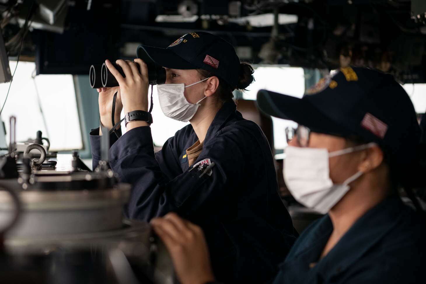 TAIWAN STRAIT (Nov. 20, 2020) – Ensign Antonia Vinci, from St. Petersburg, Fla., scans the horizon for contacts on the bridge of the guided-missile destroyer USS Barry (DDG 62) as the ship conducts routine underway operations in the Taiwan Strait. Barry is assigned to Destroyer Squadron (DESRON) 15, the Navy’s largest forward-deployed DESRON and the U.S. 7th Fleet's principal surface force, forward-deployed to the U.S. 7th Fleet area of operations in support of a free and open Indo-Pacific. (U.S. Navy photo by Lieutenant Junior Grade Samuel Hardgrove)