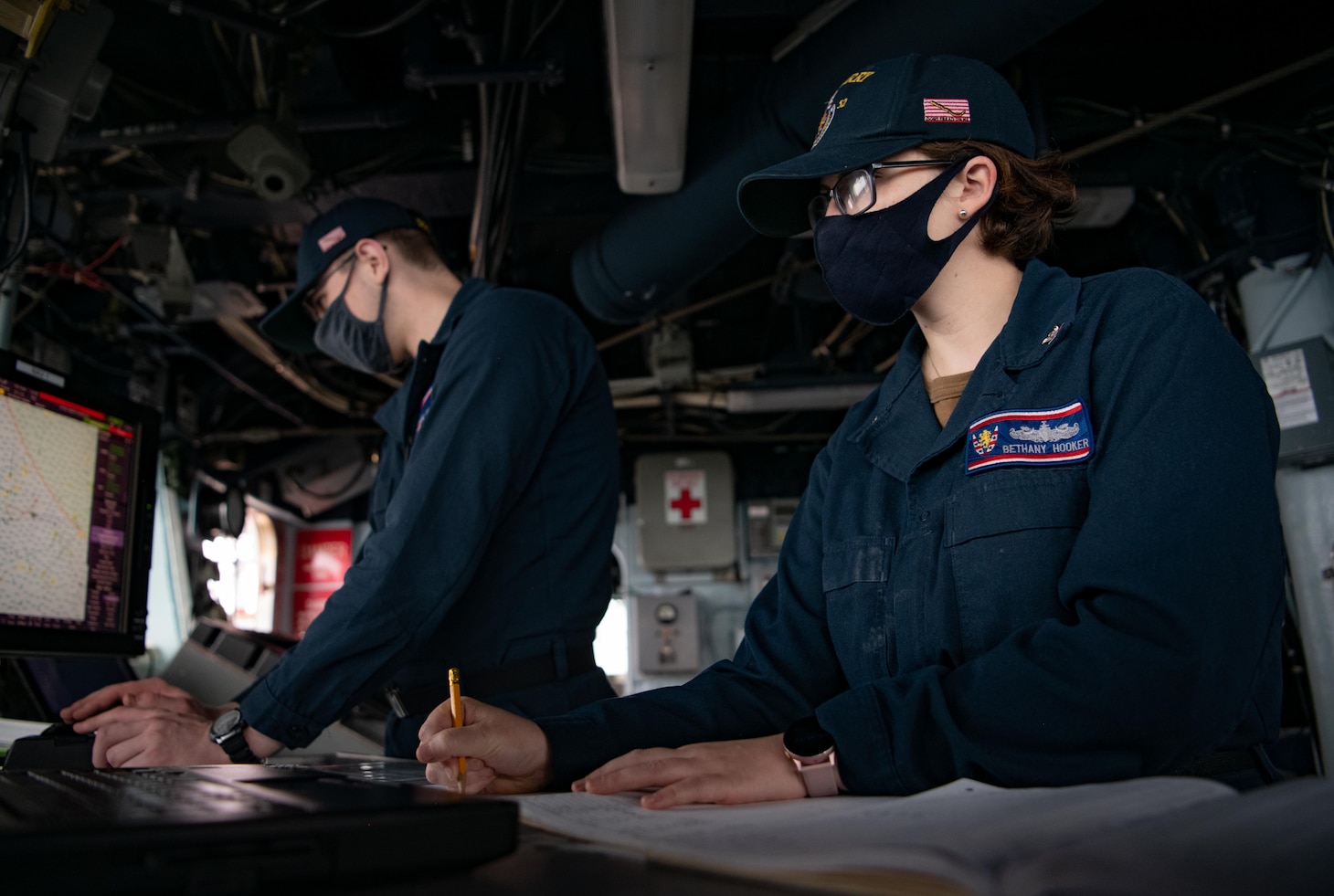 TAIWAN STRAIT (Nov. 20, 2020) – Quartermaster 3rd Class Bethany Hooker, from Dalton, Ga., logs the ship’s position at the chart table on the bridge of the guided-missile destroyer USS Barry (DDG 62) as the ship conducts routine underway operations in the Taiwan Strait. Barry is assigned to Destroyer Squadron (DESRON) 15, the Navy’s largest forward-deployed DESRON and the U.S. 7th Fleet's principal surface force, forward-deployed to the U.S. 7th Fleet area of operations in support of a free and open Indo-Pacific. (U.S. Navy photo by Lieutenant Junior Grade Samuel Hardgrove)