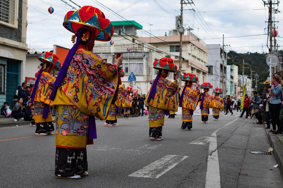 Okinawan residents perform cultural dances during the Nago City 50th Annual Cherry Blossom Festival at Nago Central Park, Okinawa, Japan, Jan. 27, 2019. The City of Nago hosts the annual Cherry Blossom Festival which attracts more than 270,000 people every year. Entertainment for the festival included carnival games, food vendors, floral displays, karaoke competitions, and a variety of cultural performances.(U.S Marine Corps Photo by Lance Cpl. Angelo Garavito)