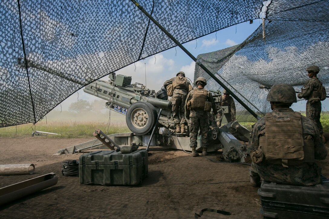 Marines with Alpha Battery, 3rd Battalion, 12th Marine Regiment, 3rd Marine Division, prepare to fire  the M777A2 155mm Howitzer during Artillery Relocation Training Program 18-2 August 5, 2018, on Camp YMA, Yausubetsu Maneuver Area, Hokkaido, Japan. ARTP 18-2 is a Japan-funded, routine training exercise that allows Marines with 3rd Battalion, 12th Marine Regiment, 3rd Marine Division, III Marine Expeditionary Force, based out of Camp Hansen, Okinawa, Japan, to conduct live-fire training in Japan. (U.S. Marine Corps photo by Lance Cpl. Tegra Shepherd)