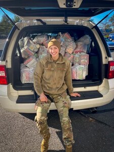 Senior Airman Alexis Maher, 103rd Security Forces Squadron defender, packs a vehicle with Thanksgiving meal kits at Bradley Air National Guard Base in East Granby, Connecticut, Nov. 16, 2020. Maher organized the squadron’s second annual Thanksgiving food drive, in which 103rd Airlift Wing members helped donate 120 family meal kits to food banks in six towns.