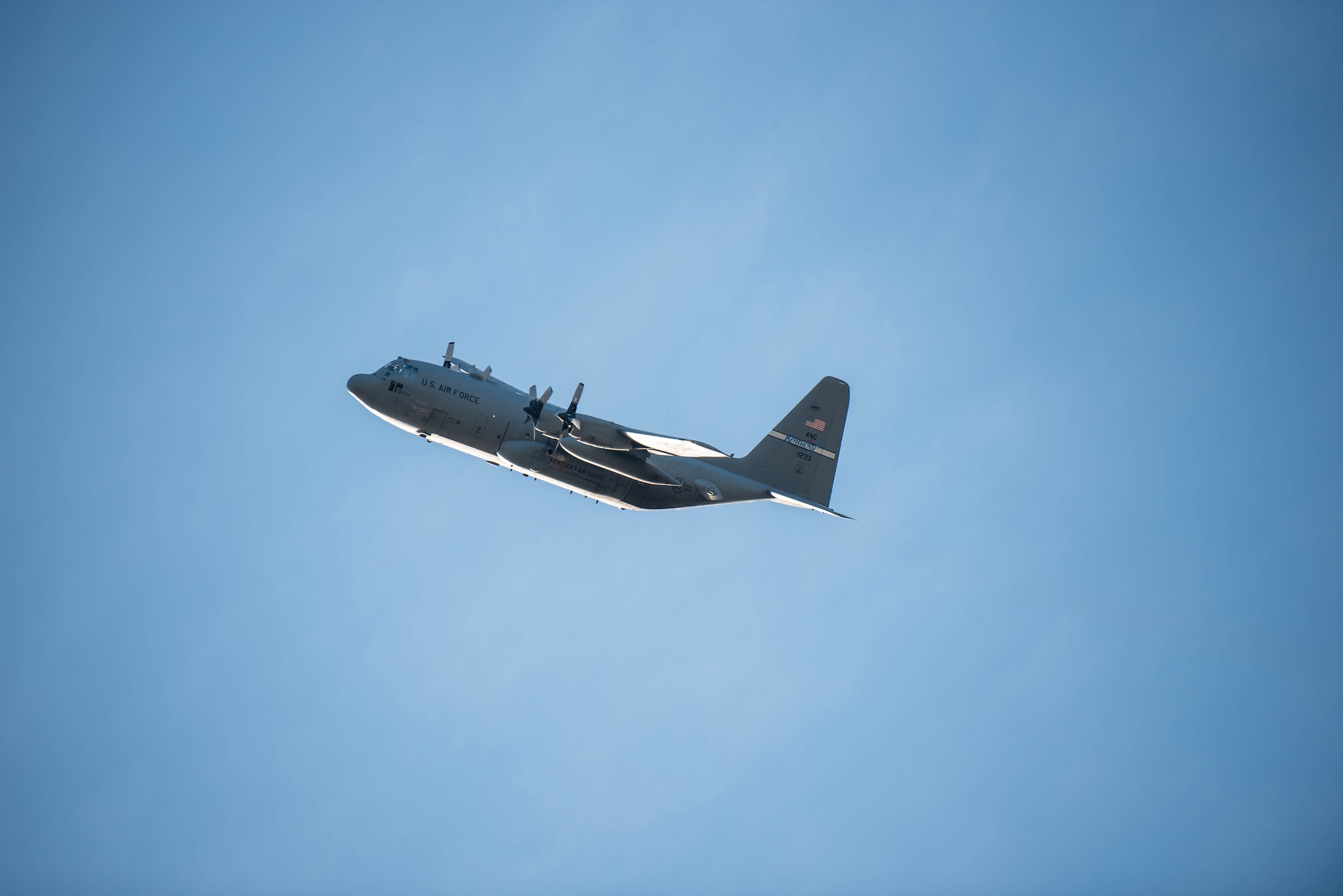 A C-130 Hercules from the 123rd Airlift Wing flies over the Kentucky Air National Guard base as more than 90 Airmen from the unit return home to Louisville, Ky., Nov. 18, 2020, after completing a four-month deployment to the Middle East in support of Operations Inherent Resolve and Freedom’s Sentinel. The Airmen operated from an undisclosed air base while flying troops and cargo across the U.S. Central Command Area of Responsibility. (U.S. Air National Guard photo by Phil Speck)