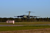 A C-17 Globemaster III assigned to Joint Base Charleston prepares to land at McEntire Joint National Guard Base, S.C., Nov. 16, 2020. Palmetto Challenge is a global mobilization exercise held at McEntire Joint National Guard Base, S.C. The exercise is held in order to develop readiness and awareness in a simulated deployed environment for over 100 Airmen from Joint Base Charleston.