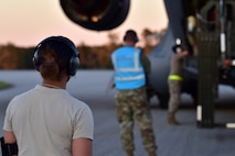 Airmen assigned to the 628th Air Base Wing begin to offload cargo from a C-17 Globemaster III at McEntire Joint National Guard Base, S.C., Nov. 16, 2020. Palmetto Challenge is a global mobilization exercise held at McEntire Joint National Guard Base, S.C. The exercise is held in order to develop readiness and awareness in a simulated deployed environment for over 100 Airmen from Joint Base Charleston.