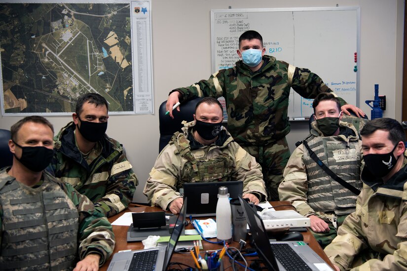 Col. Bobby DeGregorio, 315th Airlift Wing Support Group Commander, and Lt. Col Lee Holfert, 628 MSG deputy commander, pose with Airmen from the Crisis Action Team (CAT) for a photo, at McEntire Joint National Guard Base, S.C., Nov. 16, 2020. Palmetto Challenge is a global mobilization exercise held at McEntire Joint National Guard Base, S.C. The exercise is held in order to develop readiness and awareness in a simulated deployed environment for over 100 Airmen from Joint Base Charleston.