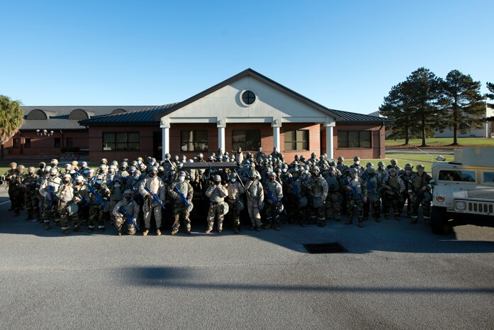 Airmen assigned to the 628th Air Base Wing pose for a group photo at McEntire Joint National Guard Base, S.C., Nov. 16, 2020. Palmetto Challenge is a global mobilization exercise held at McEntire Joint National Guard Base, S.C., and Pope Army Airfield, N.C. The exercise is held in order to develop readiness and awareness in a simulated deployed environment for over 100 Airmen from Joint Base Charleston.