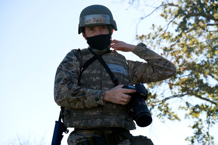 U.S. Air Force Airman 1st Class Cory Davis, a 628th Air Base Wing photojournalist, prepares to document a simulated deployed environment training scenario at McEntire Joint National Guard Base, S.C., Nov. 16, 2020. Palmetto Challenge is a global mobilization exercise held at McEntire Joint National Guard Base, S.C., and Pope Army Airfield, N.C. The exercise is held in order to develop readiness and awareness in a simulated deployed environment for over 100 Airmen from Joint Base Charleston.