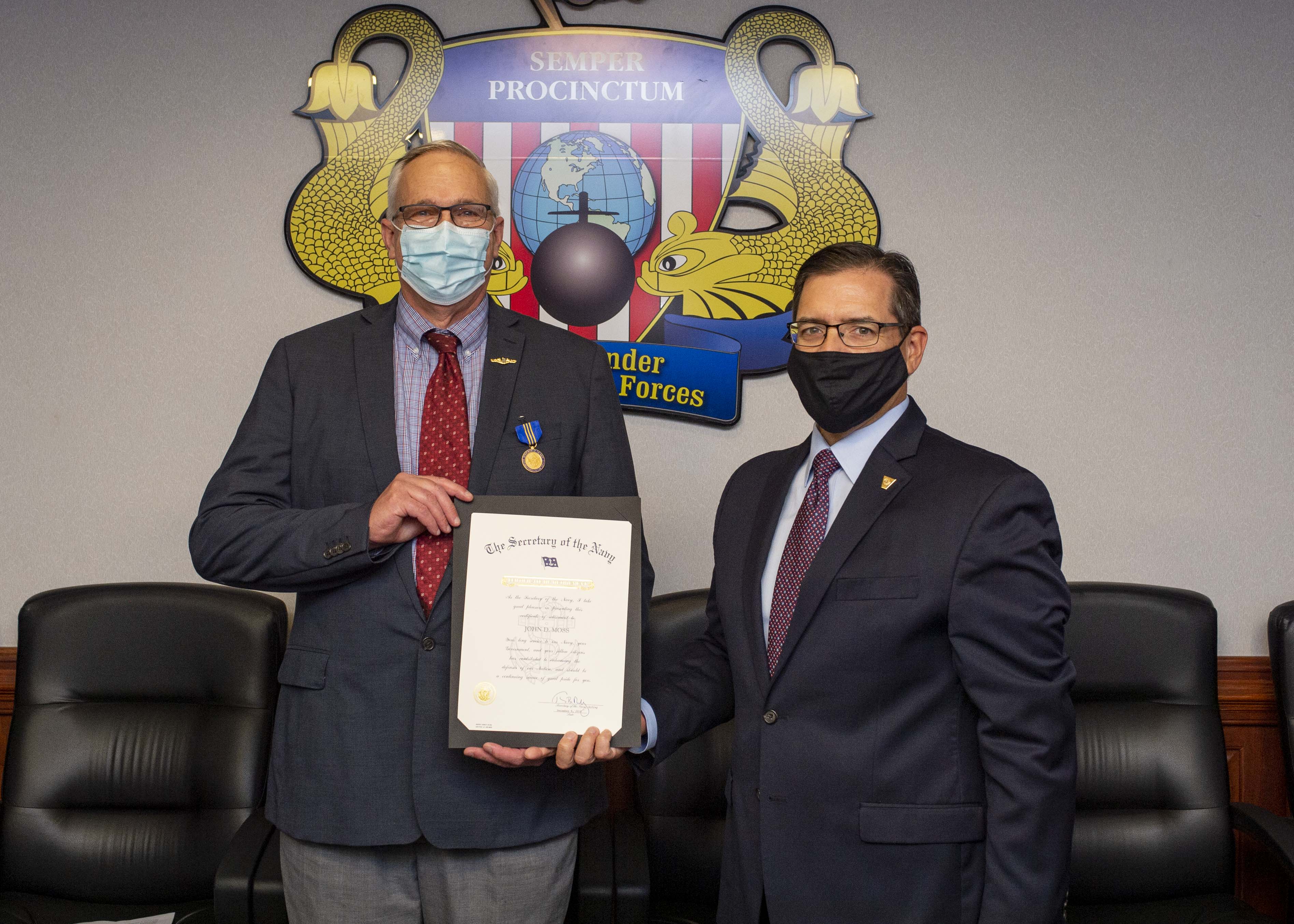 Don Hoffer, executive director, Submarine Forces, presents John D. Moss, former director, submarine requirements and warfare development, with the Department of the Navy Distinguished Civilian Service Award, Nov. 13, 2020.