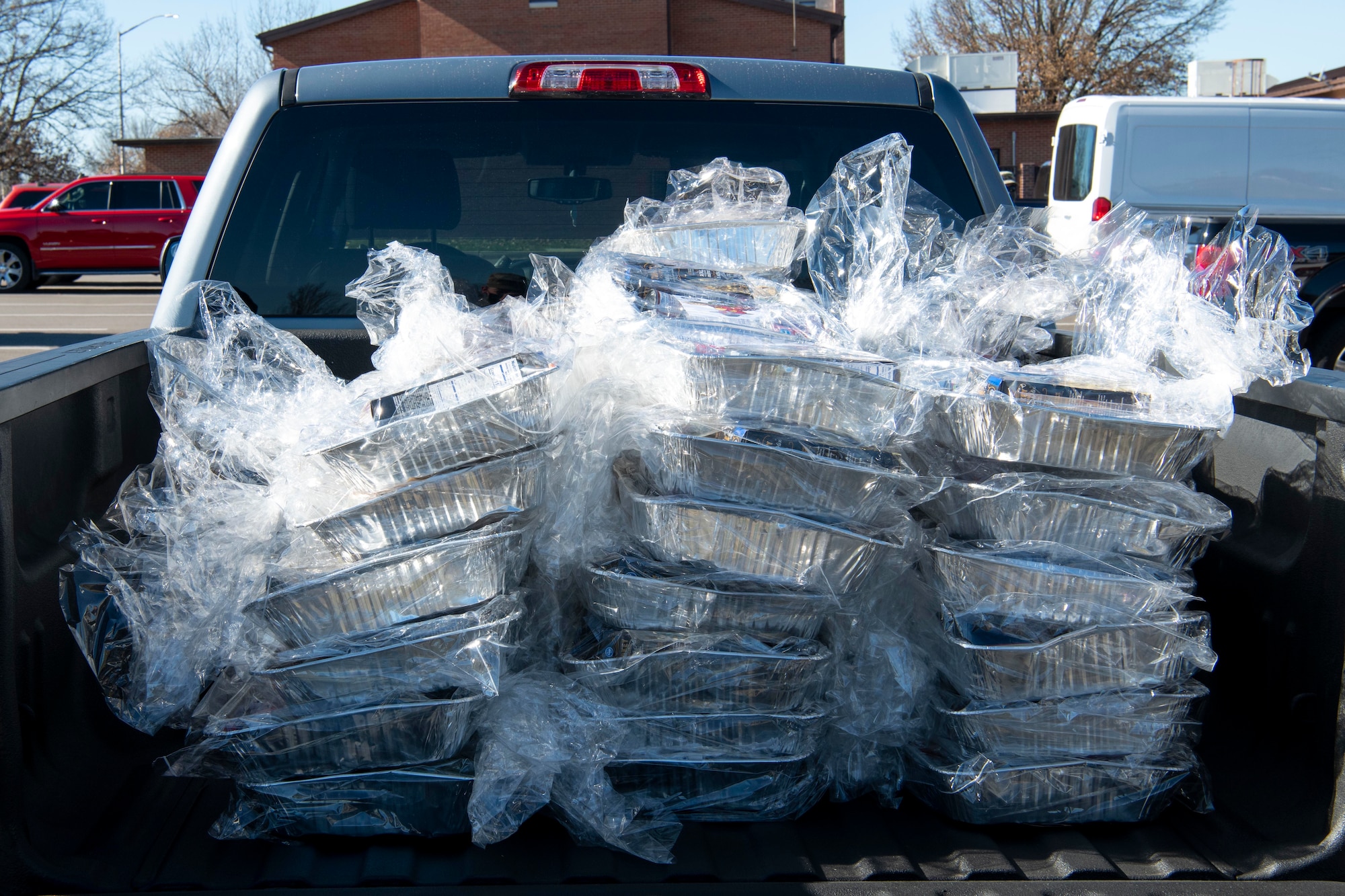 Thanksgiving food baskets sit in the back of a truck Nov. 17, 2020, at Whiteman Air Force Base, Missouri. The USO of Missouri, Inc. donated more than 900 food baskets to Team Whiteman and other military units in the area, including the National Guard and Reserve units. The food baskets included items to make a Thanksgiving meal for four and a $10 gift card to purchase a turkey. (U.S. Air Force photo by Staff Sgt. Dylan Nuckolls)
