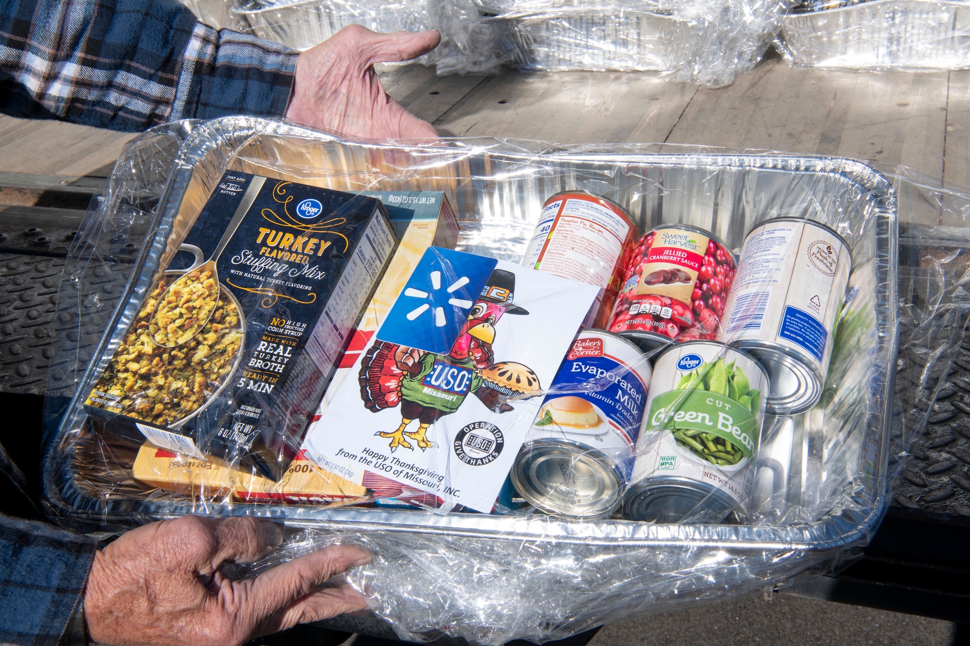 A Thanksgiving food basket is displayed Nov. 17, 2020, at Whiteman Air Force Base, Missouri. The USO of Missouri, Inc. donated more than 900 food baskets to Team Whiteman and other military units in the area, including the National Guard and Reserve units. The food baskets included items to make a Thanksgiving meal for four and a $10 gift card to purchase a turkey. (U.S. Air Force photo by Staff Sgt. Dylan Nuckolls)