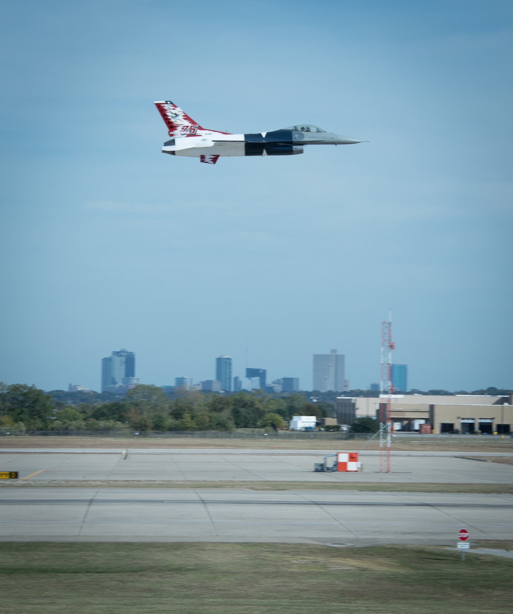 A 457th Fighter Squadron F-16 assigned to the 301st Fighter Wing, U.S. Naval Air Station Joint Reserve Base Fort Worth, Texas, flies above the Fort Worth skyline here on November 4, 2020. The 301 FW is the only Air Force Reserve Fighter unit in Texas. (U.S. Air Force photo by Jeremy Roman)