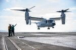 A CMV-22B Osprey from the “Titans” of Fleet Logistics Multi-Mission Squadron (VRM) 30 lands on the flight deck of the Nimitz-class aircraft carrier USS Carl Vinson (CVN 70).