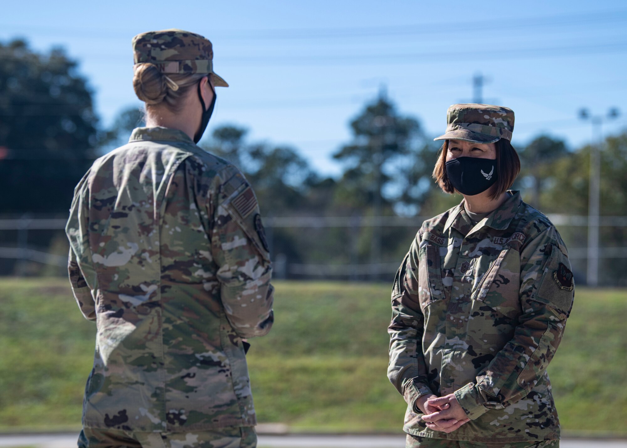 A photo of Airmen conversing.