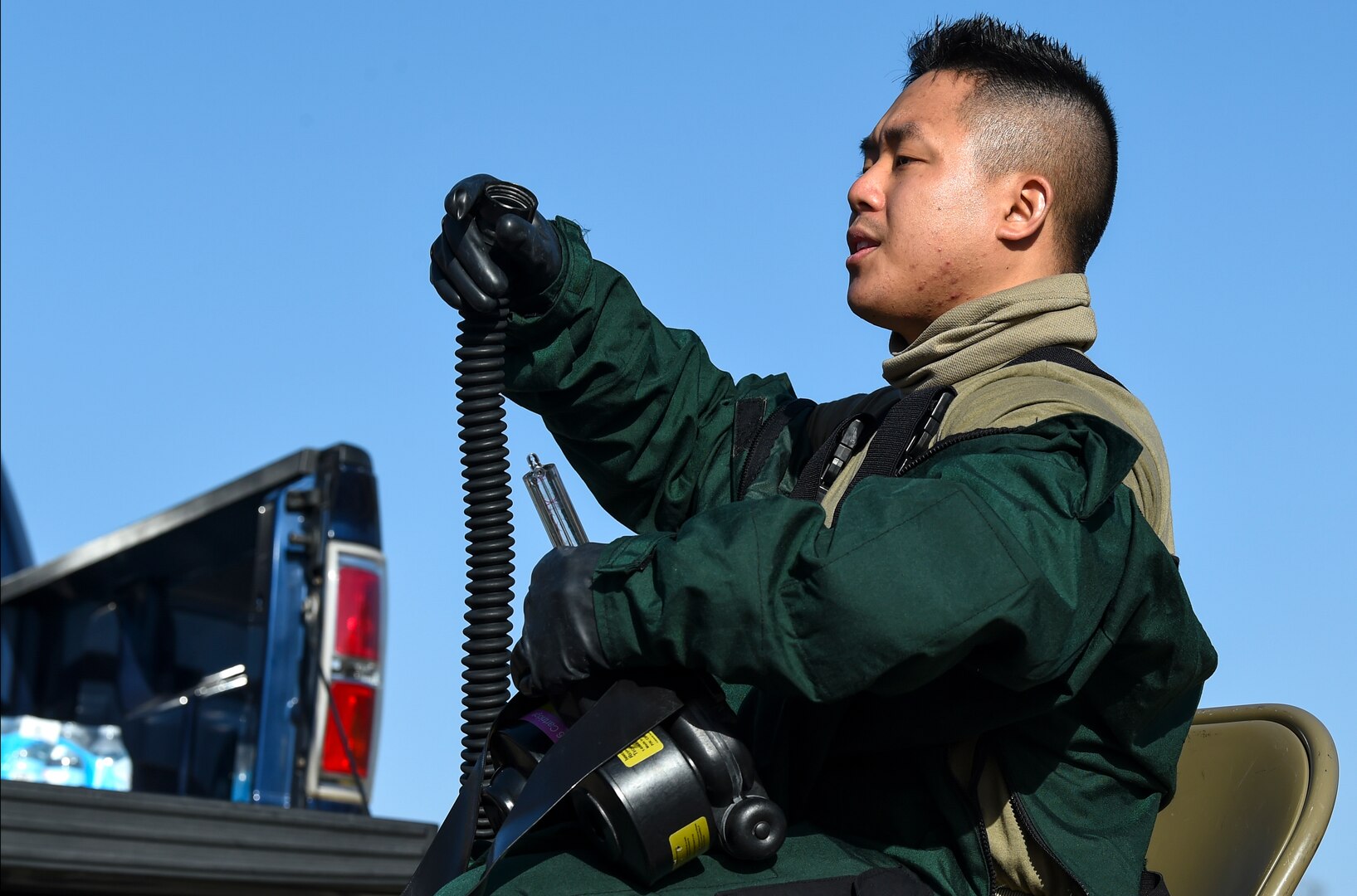 Staff Sgt. Benjamin Le of the 149th Fighter Wing’s fatality search and rescue team assembles his powered air purifying respirator gas mask during a training event Nov. 15 at Joint Base San Antonio-Lackland. The FSRT members were training on how to move into a contaminated area and recover remains after a chemical disaster.