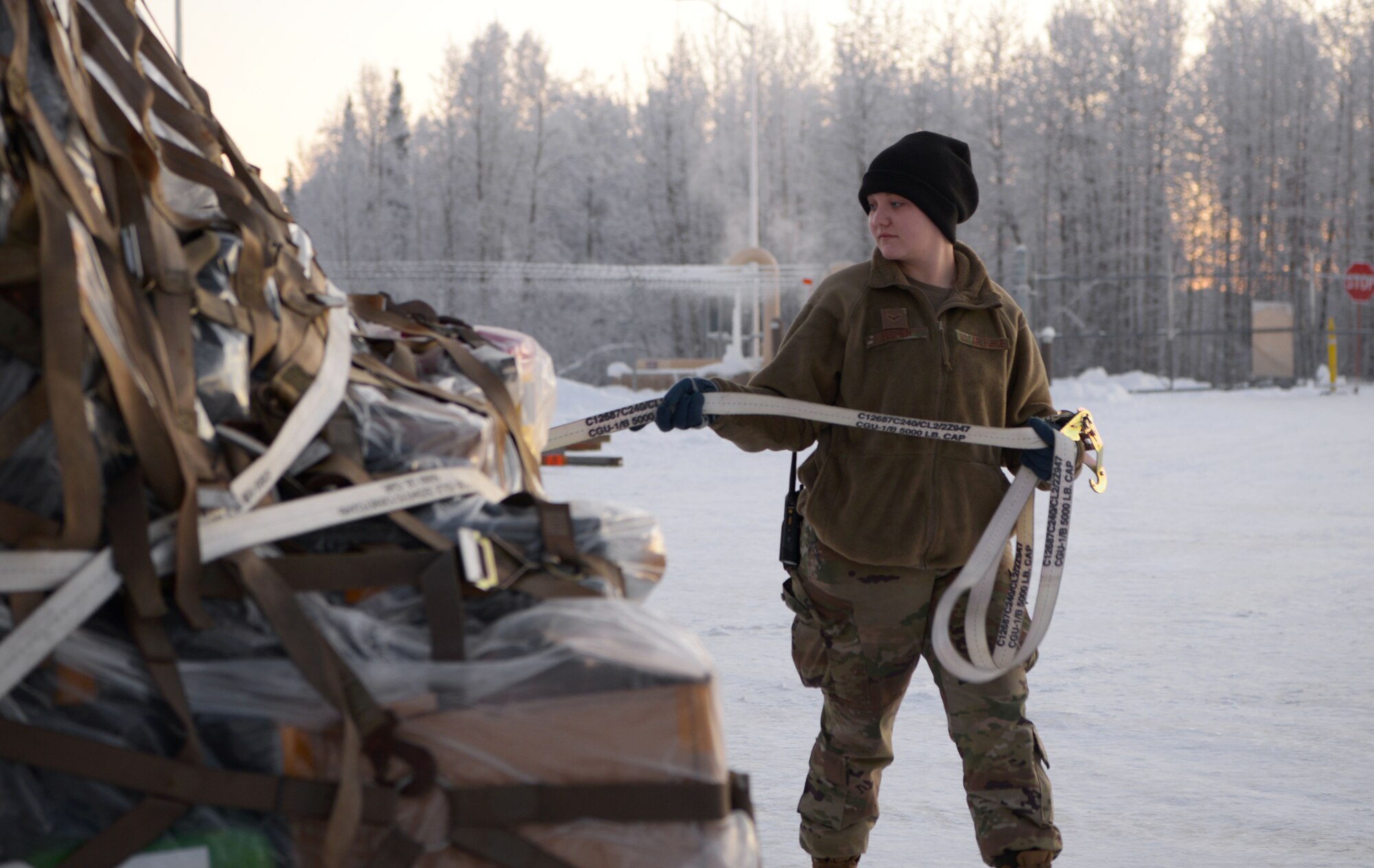 An Airman assigned to the 354th Logistics Readiness Squadron prepares cargo for transport during Arctic Gold 21-1 on Eielson Air Force Base, Alaska, Nov. 18, 2020. Thousands of pounds of equipment and hundreds of Airmen were ready to deploy alongside 12 F-35 Lightning II at a moment's notice. (U.S. Air Force photo by Senior Airman Beaux Hebert)