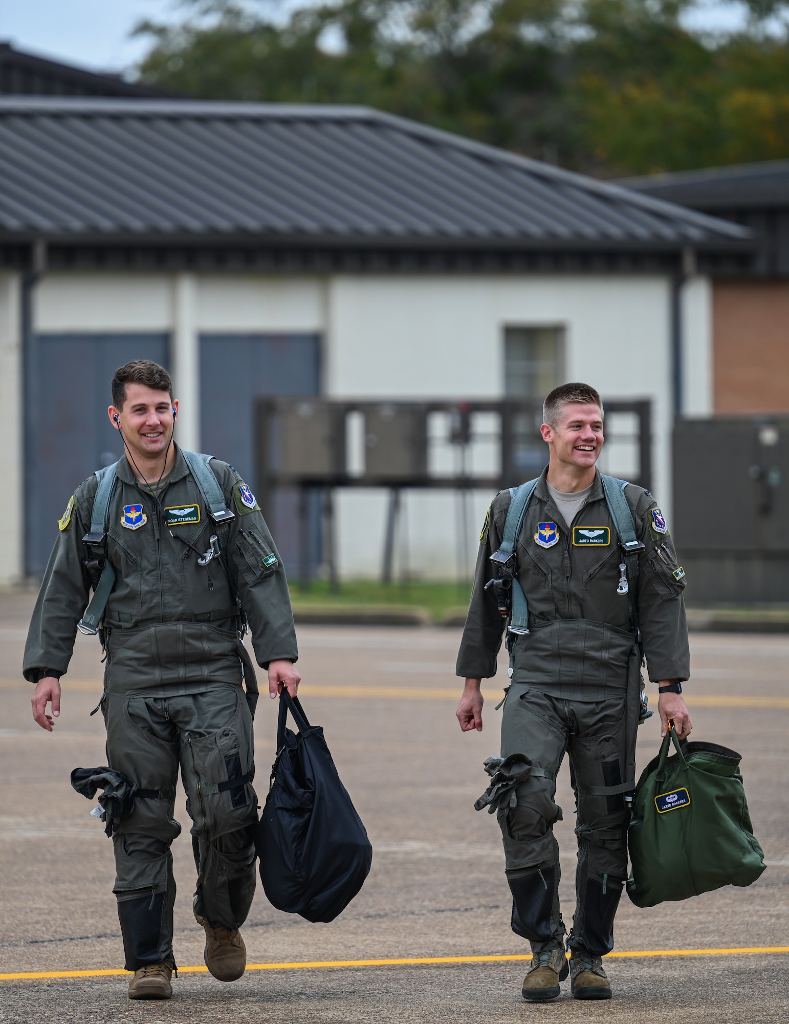 U.S. Air Force Capt. Cole Stegeman (left), 49th Fighter Training Squadron instructor pilot, and 1st Lt. Jared Rackers, 49th FTS Introduction to Fighter Fundamentals graduate, walk towards a T-38 Talon Nov. 11, 2020, on Columbus Air Force Base, Miss. Stegeman and Rackers are both assigned to the same type of aircraft, the F-15 Eagle. (U.S. Air Force photo by Airman 1st Class Davis Donaldson)