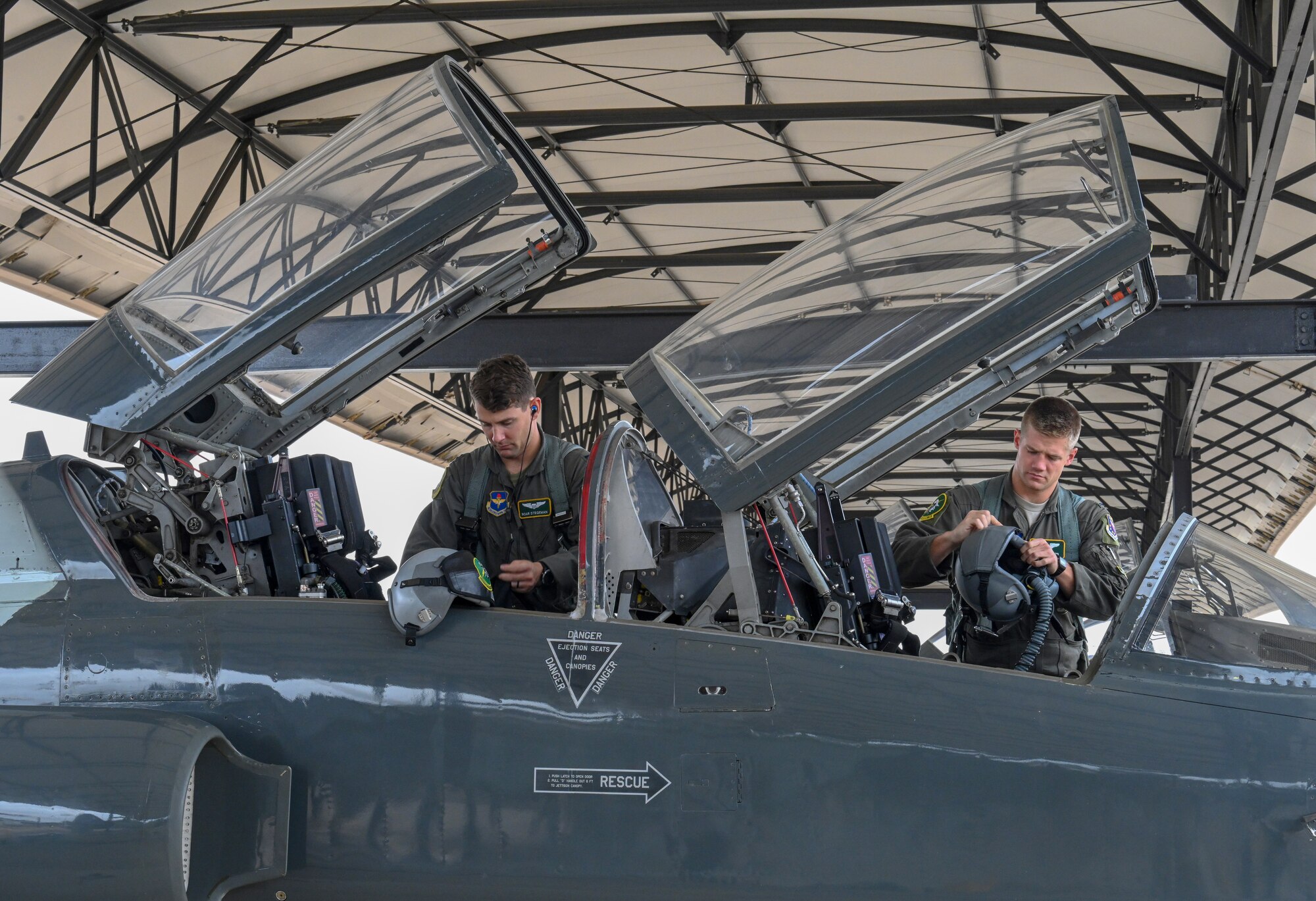 U.S. Air Force Capt. Cole Stegeman (left), 49th Fighter Training Squadron instructor pilot, and 1st Lt. Jared Rackers, 49th FTS Introduction to Fighter Fundamentals graduate, prepare for a flight in a T-38 Talon Nov. 11, 2020, on Columbus Air Force Base, Miss. Stegeman and Rackers both hail from a town called Jefferson City in Missouri and graduated from the same high school. (U.S. Air Force photo by Airman 1st Class Davis Donaldson)