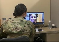 woman in army uniform in video conference