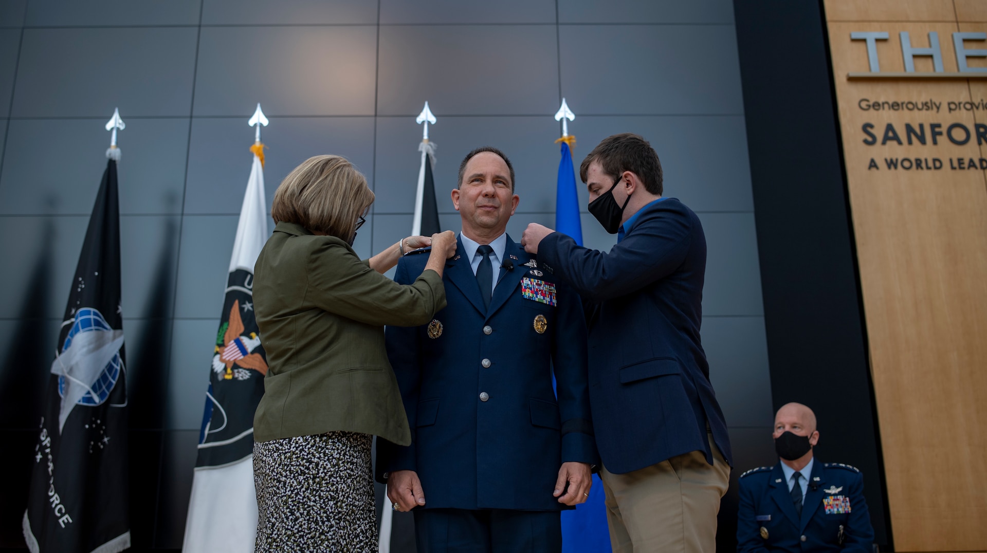 Tonia Shaw (left) and her son, Timothy Shaw (right), pin newly promoted U.S. Space Force Lt. Gen. John Shaw during the general's promotion and transfer ceremony Nov. 23, 2020, at the U.S. Air Force Academy in Colorado Springs, Colo.