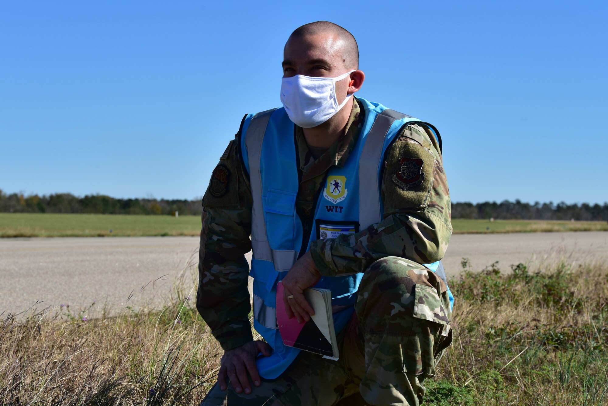 U.S. Air Force Tech. Sgt. Andrew Chilcoat, a 437th Airlift Wing Air Traffic Safety Electronics Personnel (ATSEP) evaluator, monitors as Airmen offload cargo from a C-17 Globemaster III at McEntire Joint National Guard Base, S.C., Nov. 16, 2020. Palmetto Challenge is a global mobilization exercise held at McEntire Joint National Guard Base, S.C., and Pope Army Airfield, N.C. The exercise is held in order to develop readiness and awareness in a simulated deployed environment for over 100 Airmen from Joint Base Charleston.