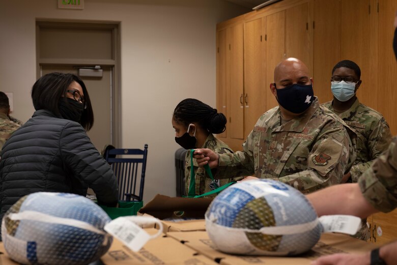 first sergeants and their family members gathered to assemble thanksgiving baskets for Peterson and Schriever AFB personnel.