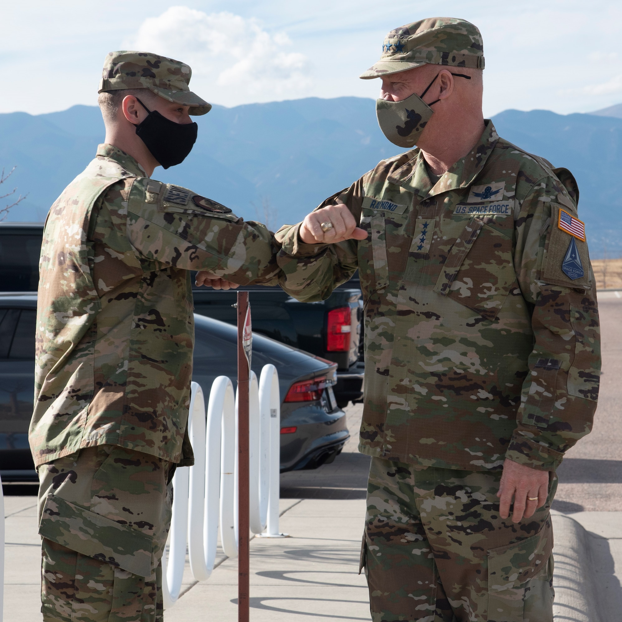 U.S. Space Force Chief of Space Operations Gen. John “Jay” Raymond, congratulates Staff Sgt. Kevin Justice, Space Delta 3, 4th Space Control Squadron space control technician