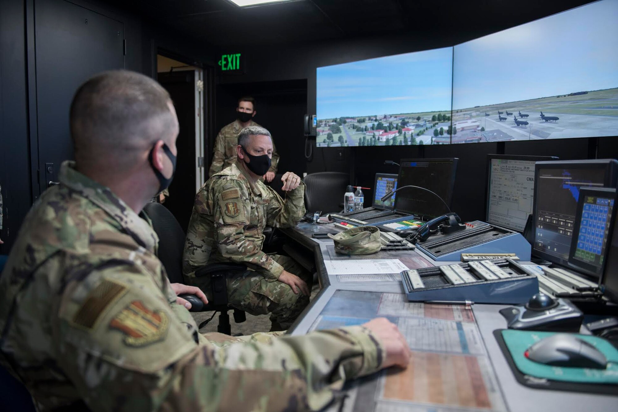 U.S. Air Force Col. Corey Simmons, left, 60th Air Mobility Wing commander, and Chief Master Sgt. Stephen Scofield, 60th Maintenance Squadron superintendent, participate in an exercise inside the control tower during Leadership Rounds Nov. 20, 2020, at Travis Air Force Base, California. The Leadership Rounds program provides 60th AMW leadership an opportunity to interact with Airmen and get a detailed view of each mission performed at Travis AFB. (U.S. Air Force photo by Senior Airman Cameron Otte)