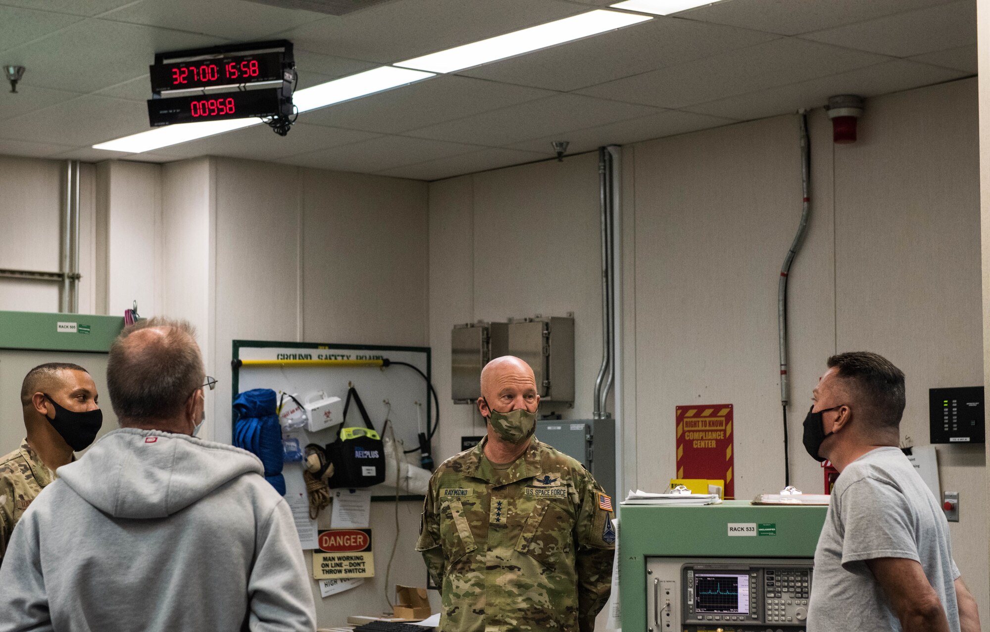 U.S. Space Force Gen. John W. "Jay" Raymond, center, Chief of Space Operations, receives a brief at the 21st Space Operations Squadron (SOS), Ka’ena Point, Oahu, Nov. 21, 2020. Raymond visited the 21st SOS detachment during his first official visit to Pacific Air Forces Headquarters at Joint Base Pearl Harbor-Hickam, Hawaii. The visit allowed Raymond to discuss the Space Force’s foundational direction and the importance of interoperability with allies and partners in the Indo-Pacific region. (U.S. Air Force photo by Staff Sgt. Hailey Haux)